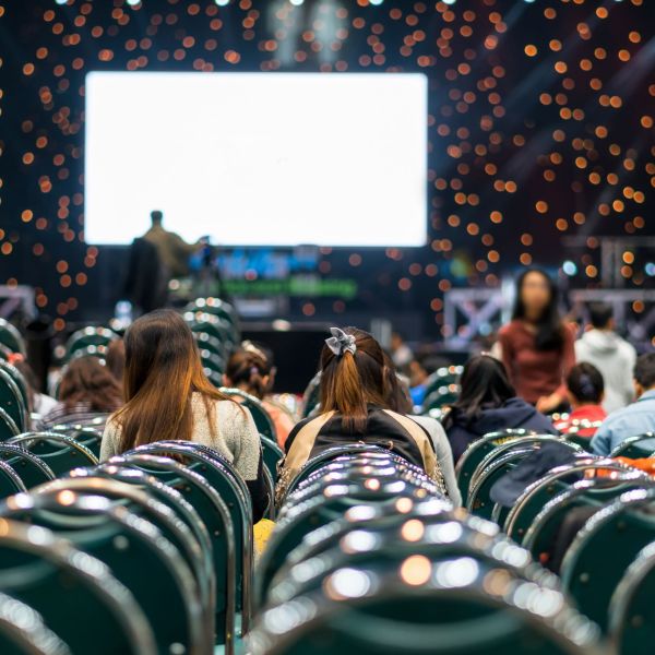 Rear view of Audience in the conference hall or seminar meeting